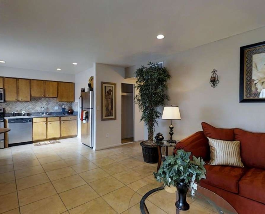 Furnished apartment living area shown — representative home at Camelback Courtyard.